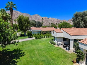 A residential area with houses featuring red-tiled roofs, surrounded by lush greenery and mountains in the background. - SRC81 - 3 BD / 2 BA, 1591 sf - Remodeled Chapala! (La Quinta)