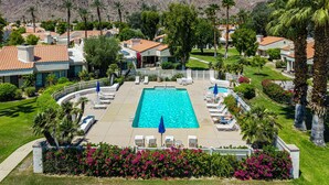 A resort with a swimming pool, palm trees, and houses with red-tiled roofs. - SRC81 - 3 BD / 2 BA, 1591 sf - Remodeled Chapala! (La Quinta)