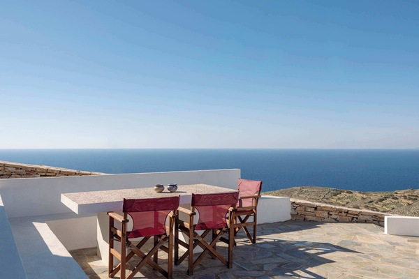 Spacious sea-view terrace with outdoor dining—perfect for morning coffee by the Aegean.