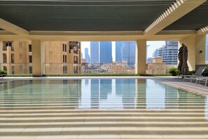 Outdoor pool, open 7:00 AM to 10:00 PM, pool umbrellas, sun loungers