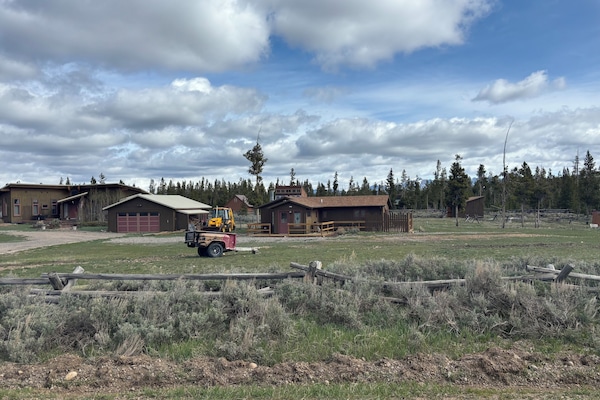 The cabin on the right is the rental. Garage and cabin on the left are our home