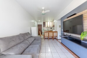 Basic Apartment | Living area | TV - Apto bem Localizado a 500mts da Praia Rhi206 (Florianópolis)