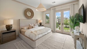 A bedroom with a large bed, two bedside tables, a round mirror, and a ceiling light. - The DOVI Collection | Gated Luxury Retreat & Pool (The Woodlands)