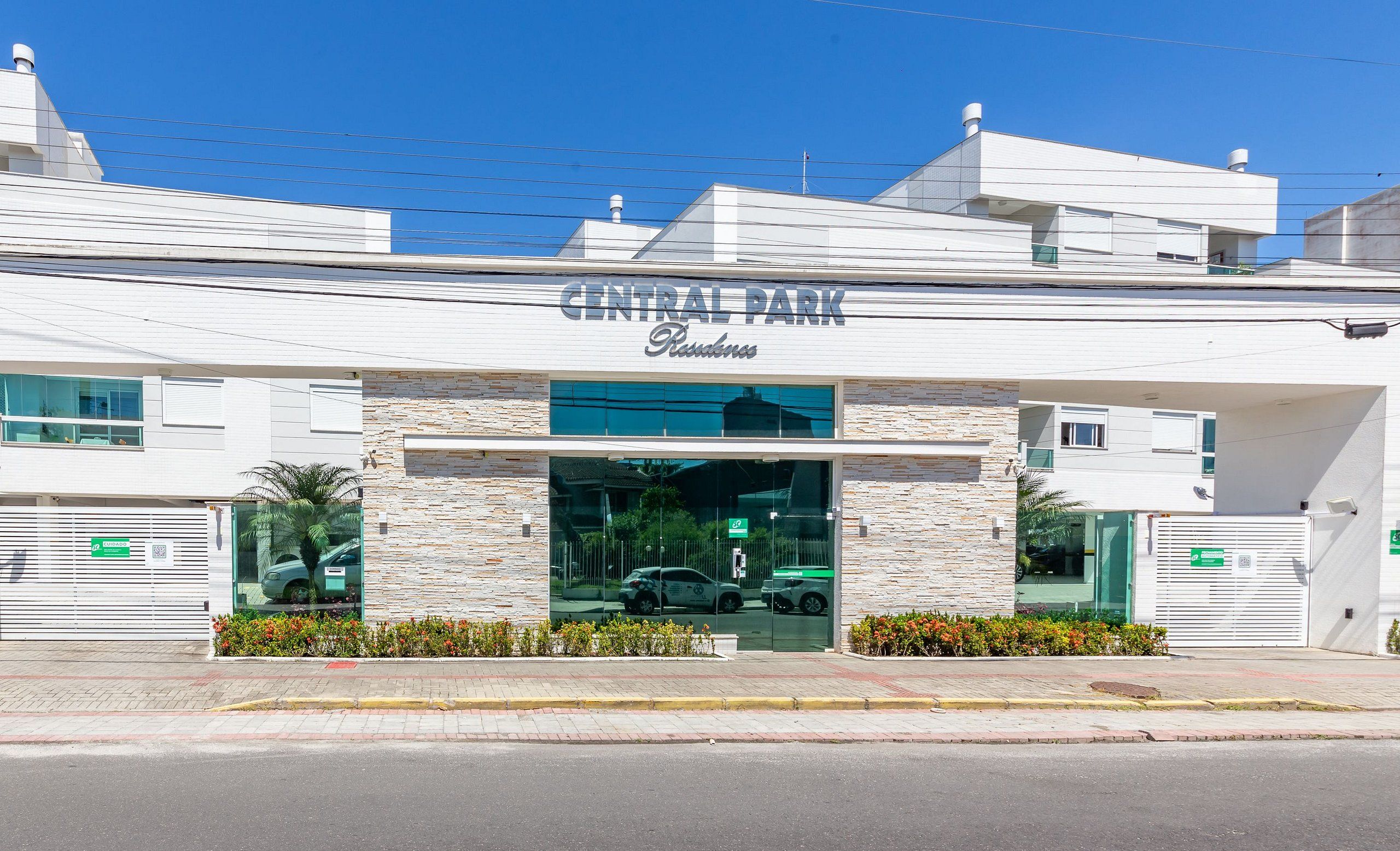 A building with a sign reading "CENTRAL PARK Residences."
