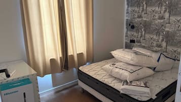 Apartment | Laptop workspace, iron/ironing board, bed sheets