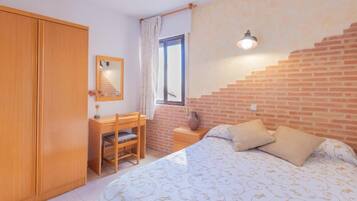 Desk, laptop workspace, free WiFi, bed sheets