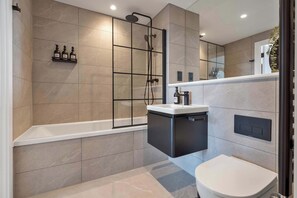 Shower, hair dryer, towels