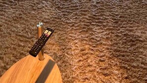 A living room with a wooden coffee table, a sofa, and a dining area with a table and chairs. - London flat close to Wembley stadium easy access to central London garden (London)