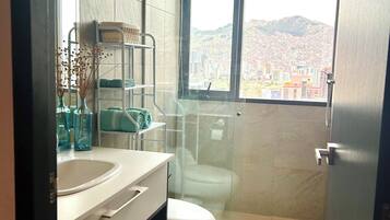 Shower, hair dryer, towels, soap