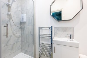 Shower, hair dryer, towels
