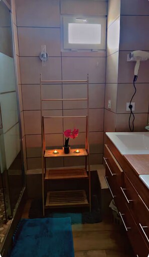 Shower, hair dryer, towels, soap