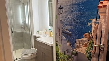 Shower, towels, soap, toilet paper