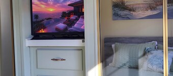 Park Model by creek and across street from beach.