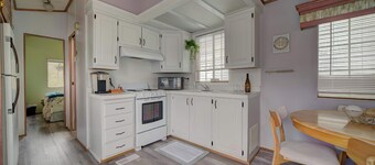 Park Model by creek and across street from beach.