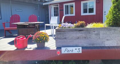Park Model by creek and across street from beach.