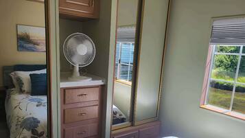 1 bedroom, desk, iron/ironing board, travel crib