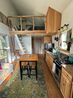 Fridge, stovetop, coffee/tea maker, cookware/dishes/utensils