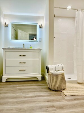 Shower, hair dryer, towels, soap