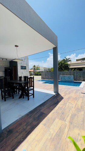 Exclusive paradise, House in a beachfront condominium.