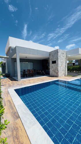 Exclusive paradise, House in a beachfront condominium.