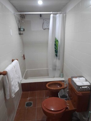 Bidet, towels, soap, toilet paper