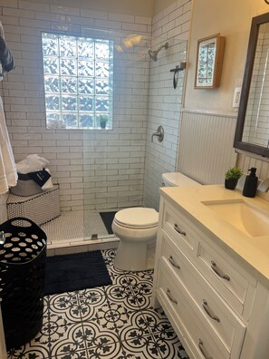 Shower, hair dryer, towels, soap