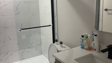 Shower, hair dryer, towels, soap