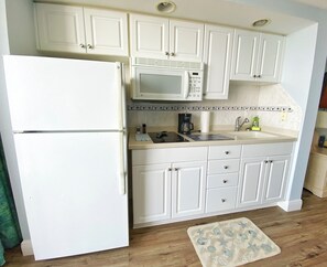 Fridge, microwave, stovetop, coffee/tea maker
