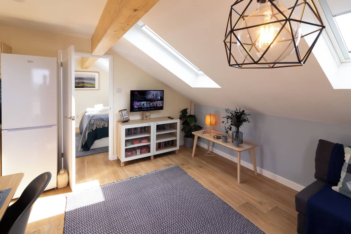 Superior Cottage, Ensuite (The Studio Cheddar) | Living area | LCD TV, DVD player, books, video library