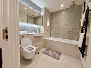 Shower, hair dryer, towels, soap