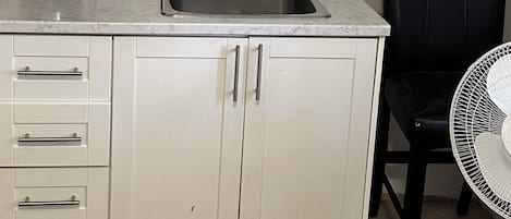 Fridge, coffee/tea maker, electric kettle, cookware/dishes/utensils