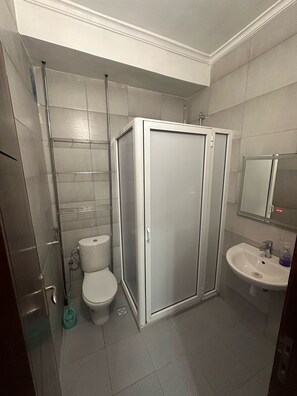 Shower, towels, soap, toilet paper