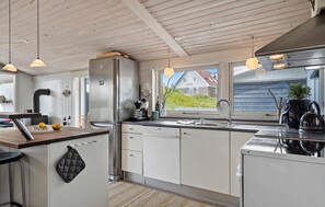Fridge, stovetop, dishwasher, coffee/tea maker