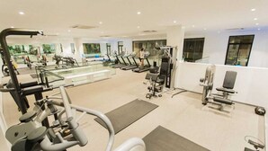 A gym with treadmills, weight machines, and exercise mats. - Imperial Suite | 1BR Pool-View Unit, Cantonments Close to KIA & American Embassy (Accra)