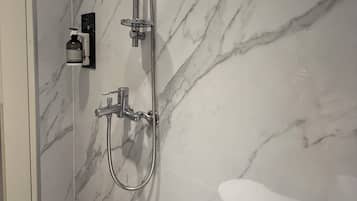 Shower, hair dryer, towels, toilet paper