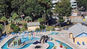 A swimming pool area with multiple pools, sun loungers, and a water slide. - Vacation Destination (Myrtle Beach)