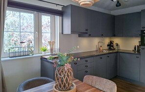 Fridge, dishwasher, coffee/tea maker, cookware/dishes/utensils