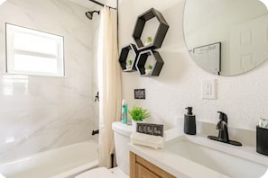 Shower, eco-friendly toiletries, hair dryer, towels