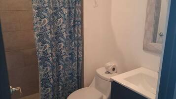 Shower, towels, soap, toilet paper