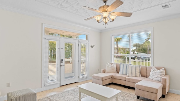 A living room with a beige sectional sofa, a white coffee table, and a ceiling fan. - Sleeps 36 2 Homes, Walk to Beach, Priv Pool + Hot Tub Tidal Wave & Seacrest (Destin)