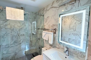 Shower, hair dryer, towels, soap