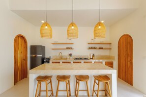 Full-sized fridge, microwave, cookware/dishes/utensils