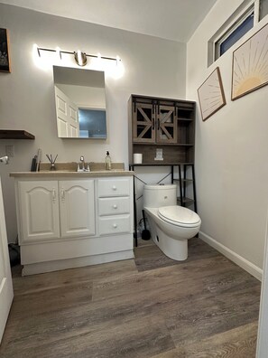 Shower, hair dryer, towels, toilet paper