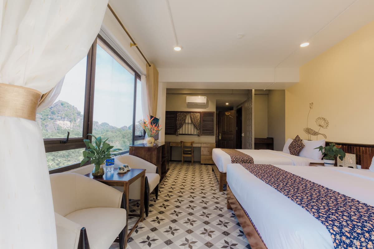 Deluxe Quadruple Room, Mountain View | Minibar, desk, iron/ironing board, free WiFi