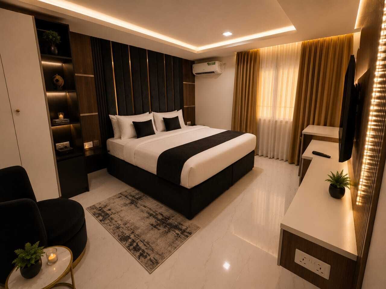 A modern bedroom with a large bed, bedside tables, a desk, and a chair.