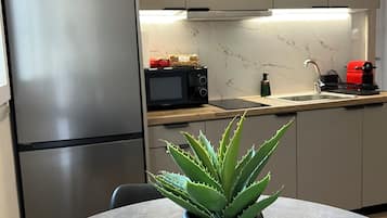 Apartment, 1 Queen Bed | Private kitchen | Fridge, microwave, espresso maker, coffee/tea maker