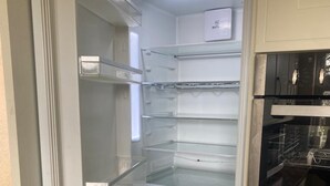 A kitchen with a built-in refrigerator, oven, and a microwave. - Glendale close - Huku Kwetu - 4 Bedroom (Nottingham)