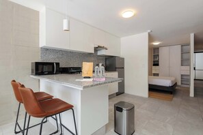 Fridge, microwave, stovetop, coffee/tea maker