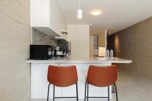 Fridge, microwave, stovetop, coffee/tea maker