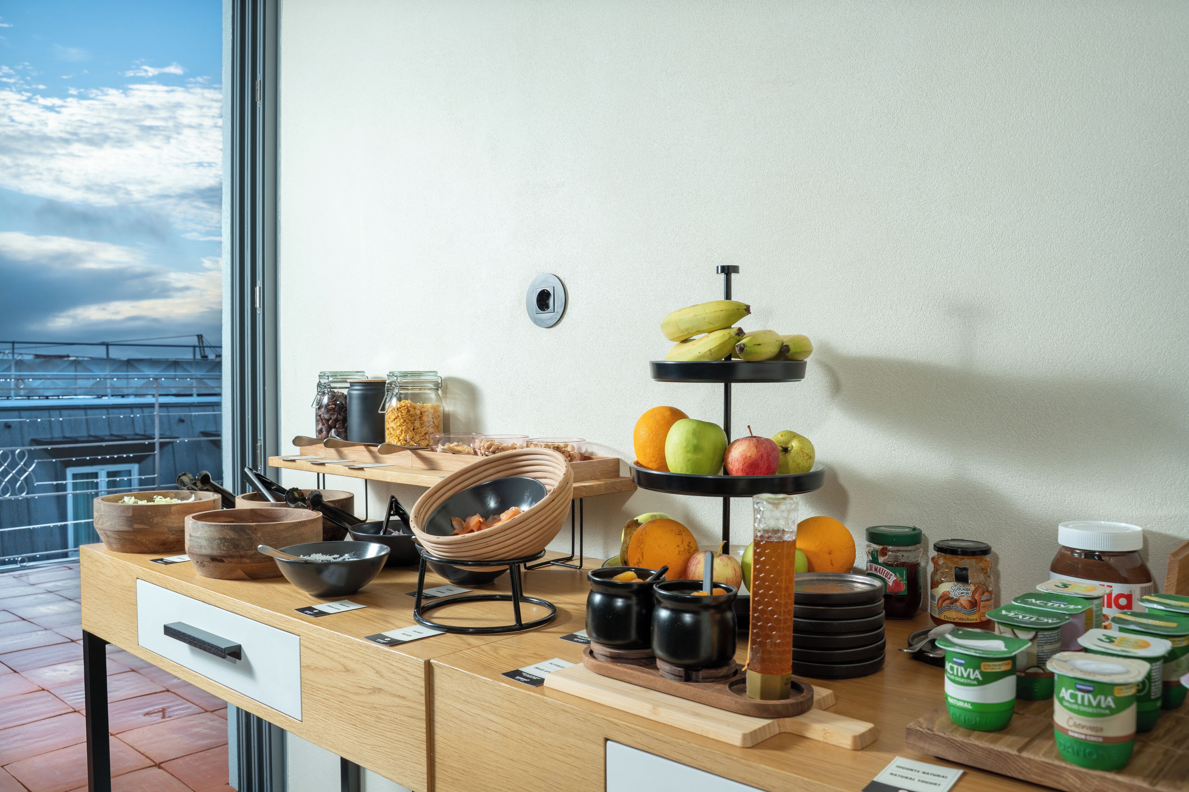 A breakfast buffet with various food items and condiments.